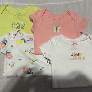 Set of Four Baby Onesies with Floral and Butterfly Designs